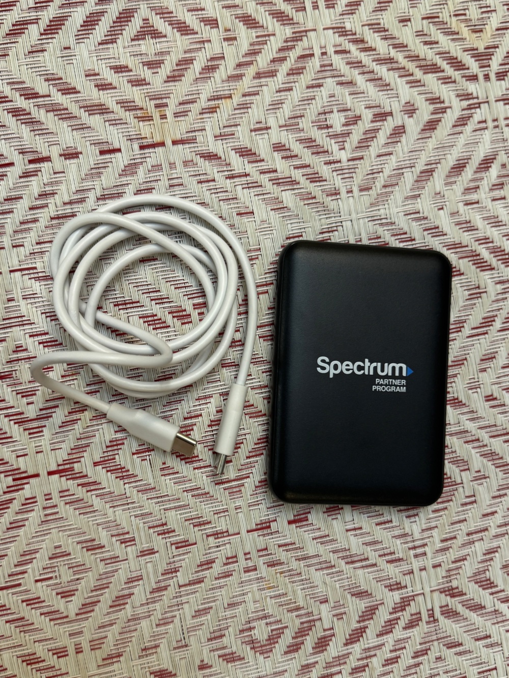 Portable Power Bank 5,000 mAh - in Black with White Charging Cable
